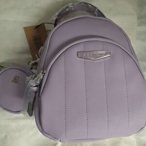 Steve Madden BJENN Backpack. Lavender With Top Handle, and a Round Ipod Case.